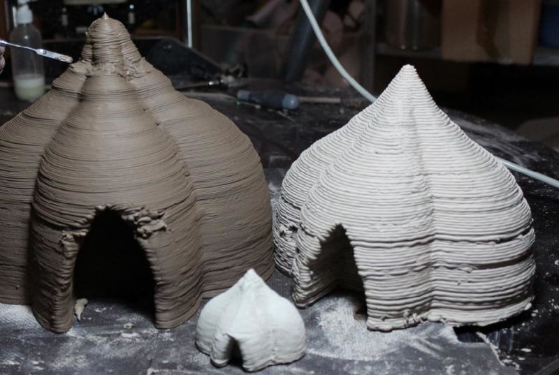 The distinctive house shapes the BigDelta 3D printer can create, seen at a much smaller scale