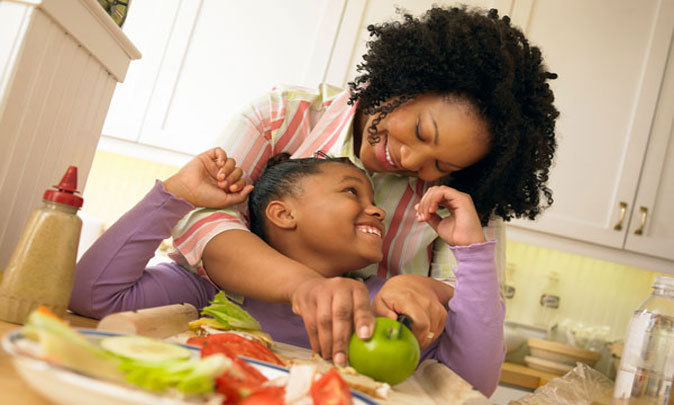 alt="Mother and Child eating"