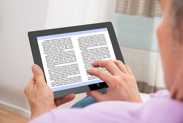 alt= man reading e-book on iPad