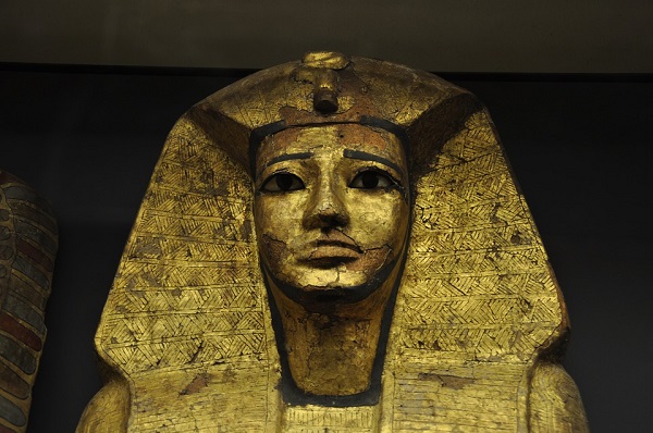 Golden pharaoh mask in a museum