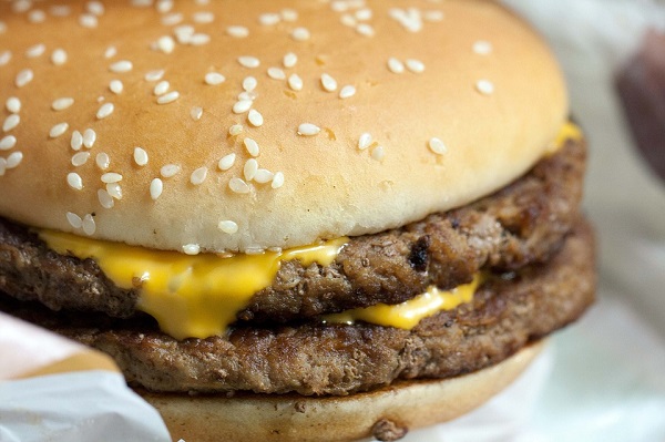 Cheeseburger containing two burger patties with cheese on top
