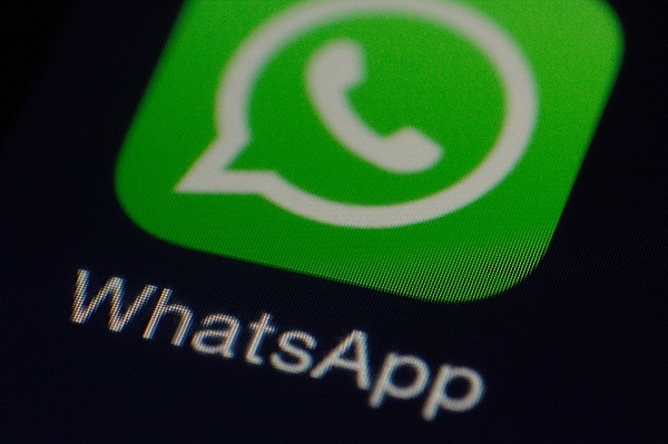 WhatsApp logo on a phone display